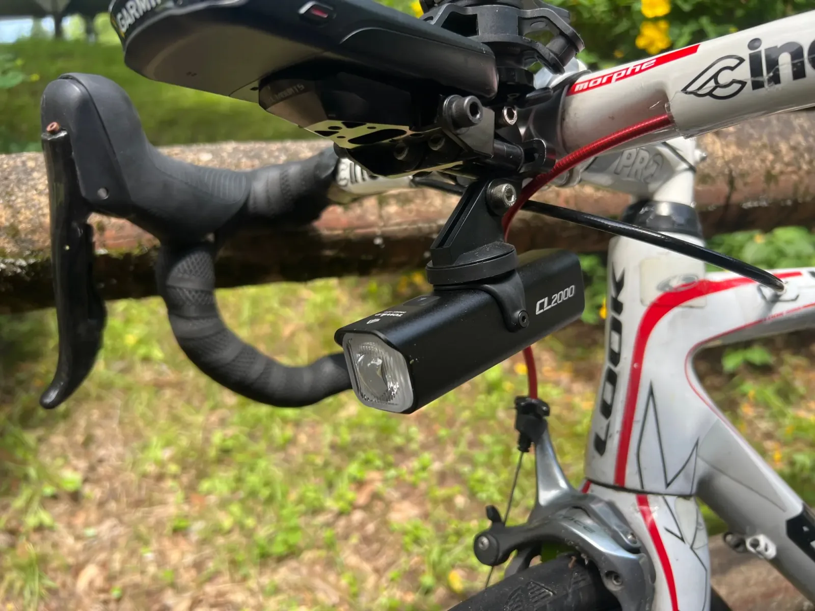 Towild CL2000 cycling light mounted below a bicycle handlebar